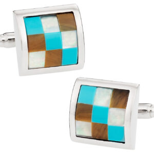 A pair of cufflinks with different colored squares.