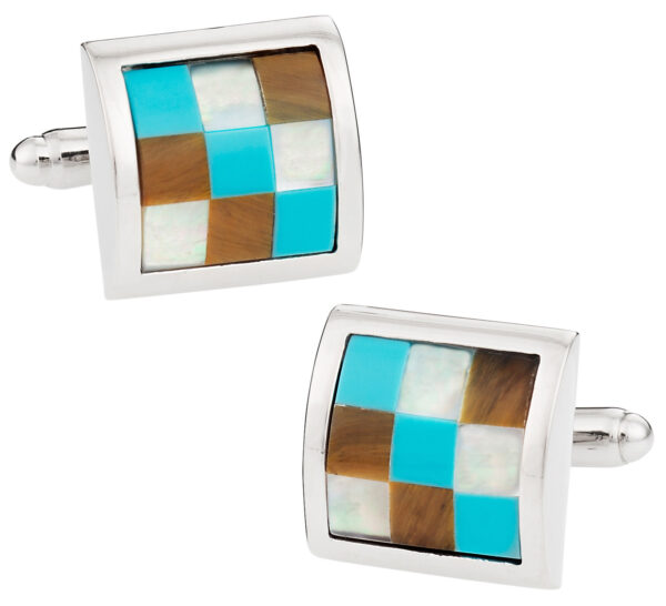 A pair of cufflinks with different colored squares.