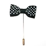 A black and white bow tie with a gold stick