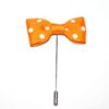 A bow tie with white polka dots on it.