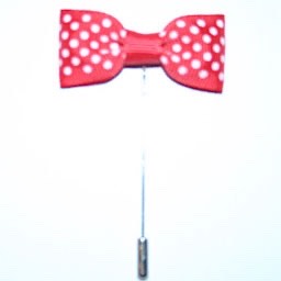 A red bow tie with white polka dots on it.