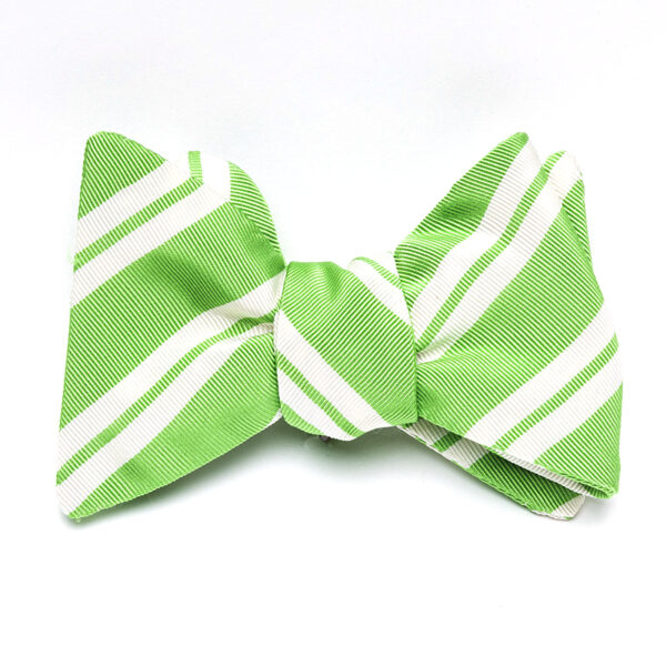 A green bow tie with white stripes on it.