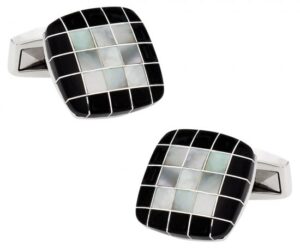 A pair of cufflinks with black and white squares.