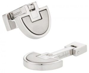 A pair of silver cufflinks with the word " buckle ".