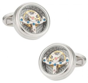 A pair of cufflinks with a watch movement.