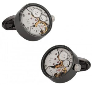 A pair of cufflinks with a watch mechanism.