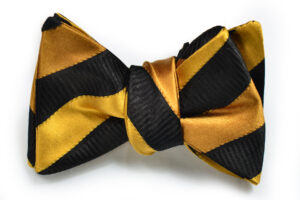 A bow tie with black and gold stripes.